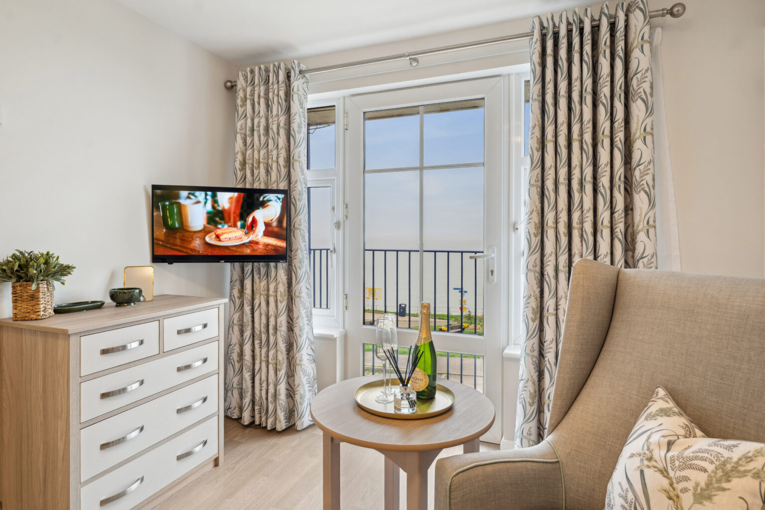 TV and radio in living area in room in Island Sands care home