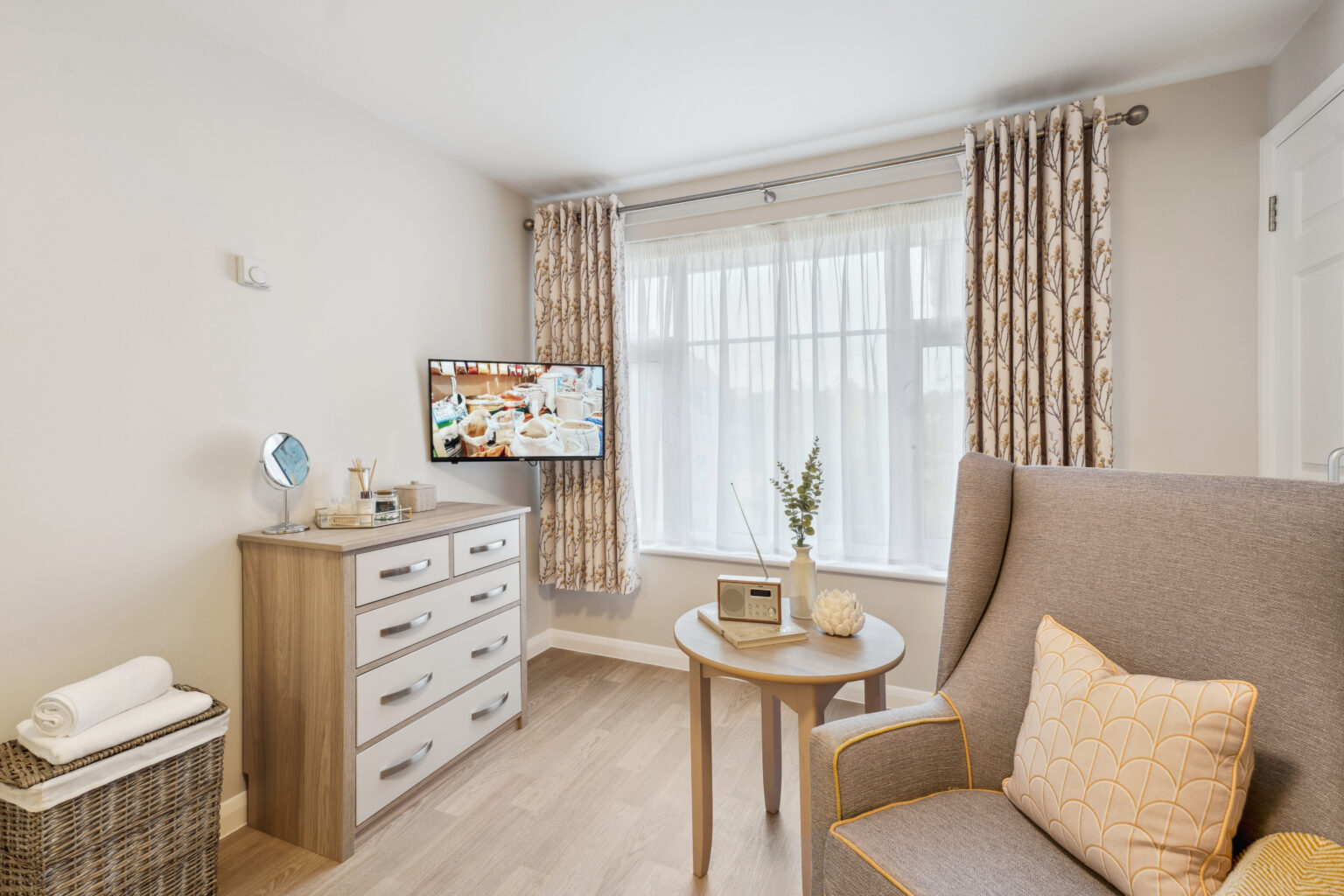 TV and radio in living area in room in Island Sands care home