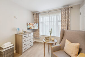 TV and radio in living area in room in Island Sands care home
