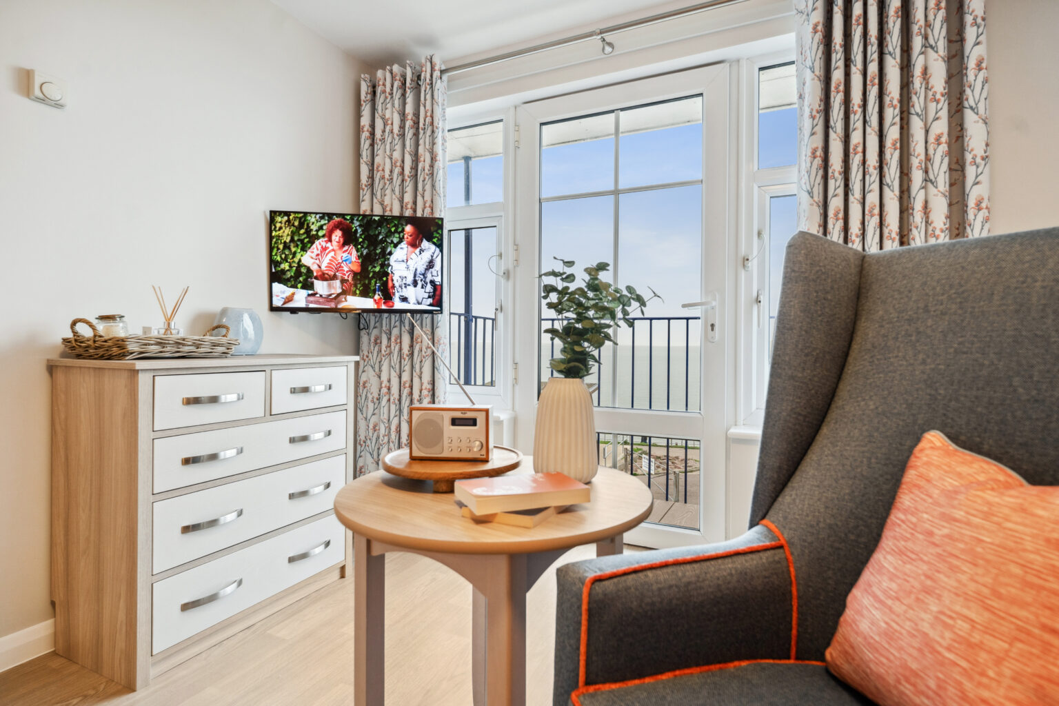 TV and radio in living area in room in Island Sands care home